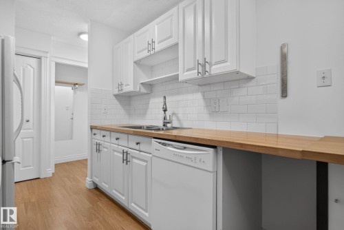 #108 10520 80 Av Nw, Edmonton, AB - Indoor Photo Showing Kitchen With Double Sink