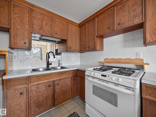 14031 63 Street Nw, Edmonton, AB - Indoor Photo Showing Kitchen With Double Sink