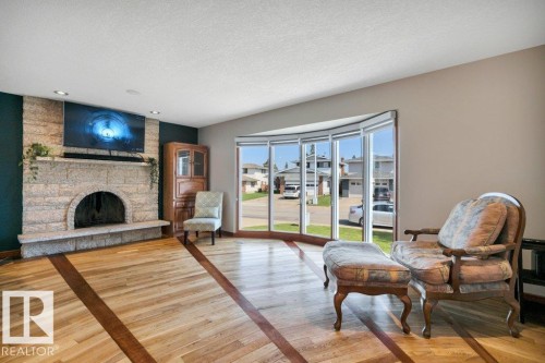 6960 21 Avenue Nw, Edmonton, AB - Indoor Photo Showing Living Room With Fireplace