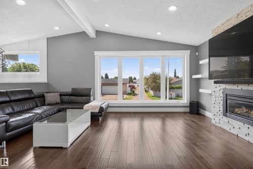3911 67 Street Nw, Edmonton, AB - Indoor Photo Showing Living Room With Fireplace