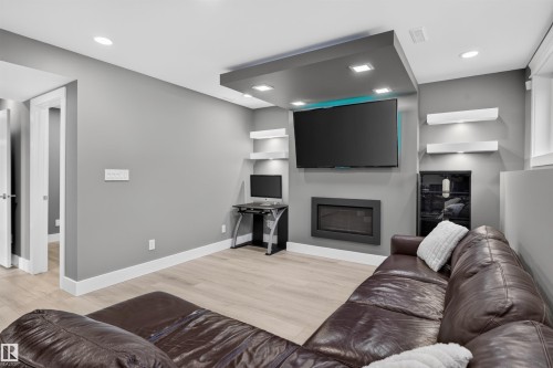 3911 67 Street Nw, Edmonton, AB - Indoor Photo Showing Living Room With Fireplace