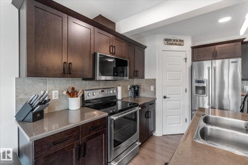 148 Brickyard Place, Stony Plain, AB - Indoor Photo Showing Kitchen With Double Sink With Upgraded Kitchen