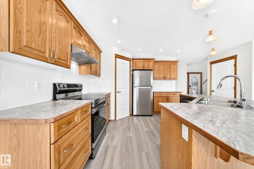 686 Kananaskis Drive, Devon, AB - Indoor Photo Showing Kitchen With Stainless Steel Kitchen With Double Sink