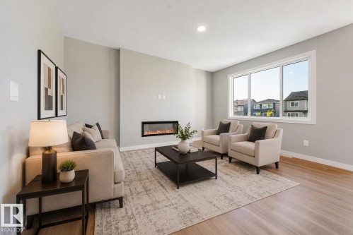 7122 52 Ave Beaumont, Beaumont, AB - Indoor Photo Showing Living Room With Fireplace