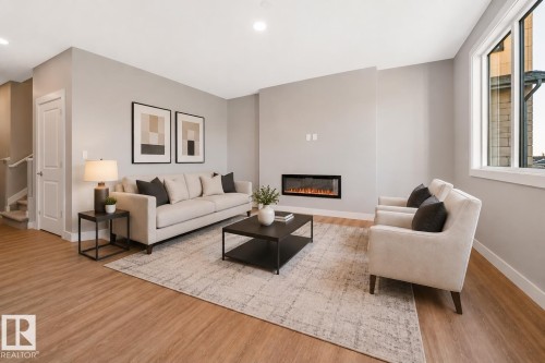 7122 52 Ave Beaumont, Beaumont, AB - Indoor Photo Showing Living Room With Fireplace
