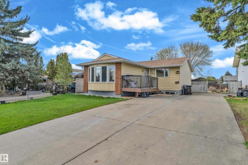 Ranch-style exterior with yellow siding and brick accents - 3520 19 Avenue Nw, Edmonton, AB - Outdoor