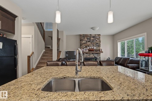 8005 223 Street Nw, Edmonton, AB - Indoor Photo Showing Kitchen With Fireplace With Double Sink With Upgraded Kitchen