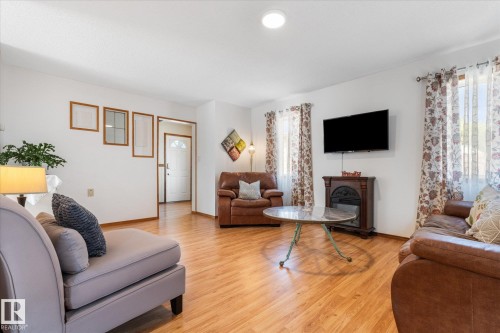 76 Chungo Crescent, Devon, AB - Indoor Photo Showing Living Room With Fireplace