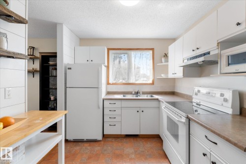 76 Chungo Crescent, Devon, AB - Indoor Photo Showing Kitchen With Double Sink