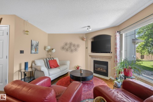 #2 20 Norman Ct, St. Albert, AB - Indoor Photo Showing Living Room With Fireplace