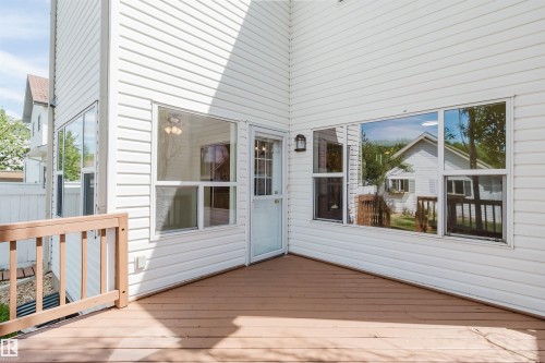 Spacious outdoor deck with wood-finish flooring and light wood railing - 1686 Tompkins Wynd Nw, Edmonton, AB - Outdoor With Deck Patio Veranda With Exterior