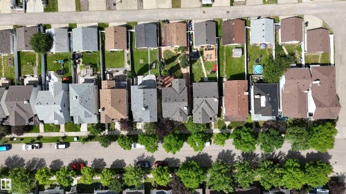 Aerial perspective showcasing a residential neighborhood with varied architectural styles - 1686 Tompkins Wynd Nw, Edmonton, AB - 