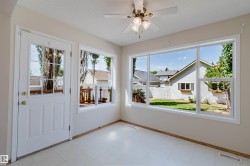 Bright interior space with light-toned walls and vinyl flooring - 