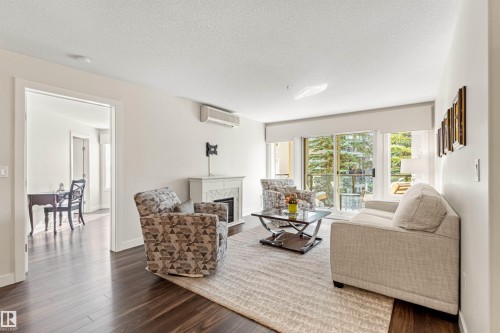 #203 8956 156 St Nw, Edmonton, AB - Indoor Photo Showing Living Room With Fireplace