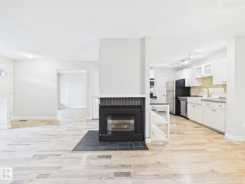 152 Surrey Gardens, Edmonton, AB - Indoor With Fireplace