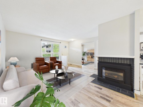 152 Surrey Gardens, Edmonton, AB - Indoor Photo Showing Living Room With Fireplace