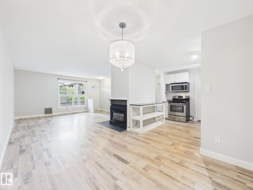 152 Surrey Gardens, Edmonton, AB - Indoor Photo Showing Living Room With Fireplace