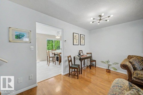 Open doorway leading to a separate room with outdoor access - #39 2419 133 Av Nw, Edmonton, AB - Indoor