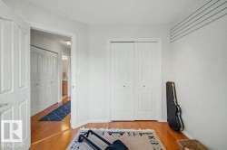 Hardwood flooring extending throughout, complemented by white walls and trim - 