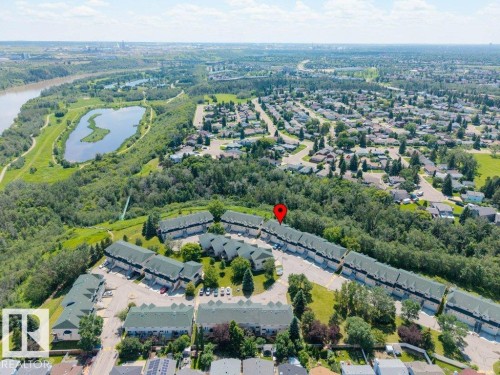 Aerial perspective showcasing a community of townhome-style residences with green roofs - #39 2419 133 Av Nw, Edmonton, AB - Outdoor With View