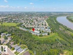 Aerial perspective showcasing a community of multi-unit dwellings - 