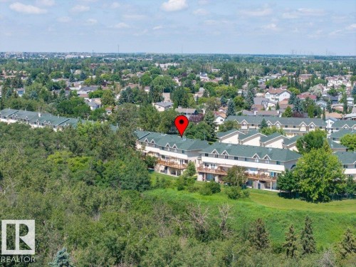 Townhome development featuring multiple units with green roofs and private balconies - #39 2419 133 Av Nw, Edmonton, AB - Outdoor With View