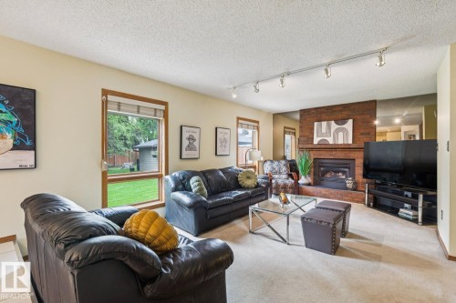 15804 80 Street Nw, Edmonton, AB - Indoor Photo Showing Living Room With Fireplace
