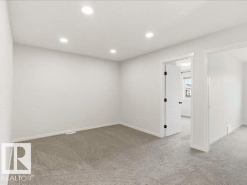 Room with recessed ceiling lights, light gray carpeting, and white walls - 17487 77 Street, Edmonton, AB - Indoor