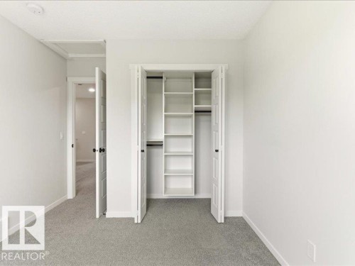 Bedroom featuring light grey carpeting, white walls, and white baseboards - 17487 77 Street, Edmonton, AB - Indoor