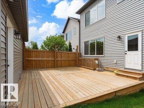 Spacious wood deck with direct exterior access, privacy fencing, and two exterior light fixtures - 17487 77 Street, Edmonton, AB - Outdoor With Deck Patio Veranda With Exterior