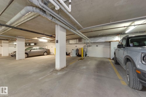 #102 10606 84 Av Nw, Edmonton, AB - Indoor Photo Showing Garage