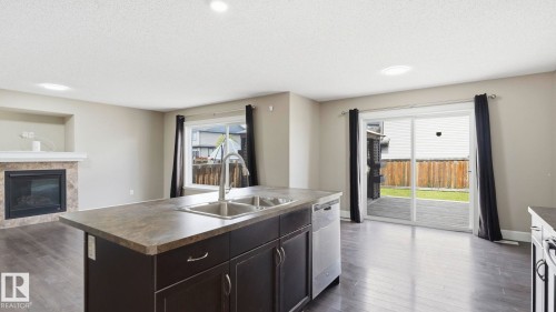 17211 78 Street Nw, Edmonton, AB - Indoor Photo Showing Kitchen With Fireplace With Double Sink