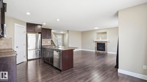 17211 78 Street Nw, Edmonton, AB - Indoor Photo Showing Kitchen With Fireplace With Double Sink