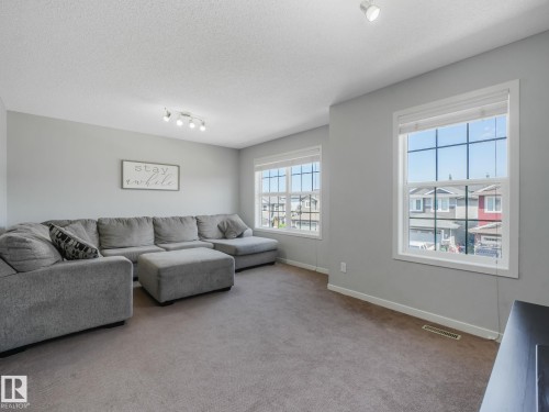 908 Goshawk Point(E) Nw, Edmonton, AB - Indoor Photo Showing Living Room