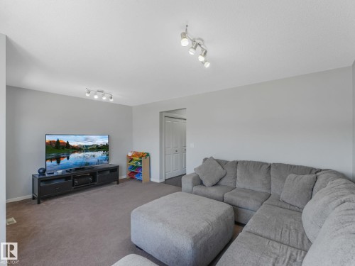 908 Goshawk Point(E) Nw, Edmonton, AB - Indoor Photo Showing Living Room