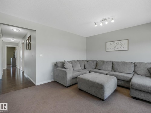 908 Goshawk Point(E) Nw, Edmonton, AB - Indoor Photo Showing Living Room