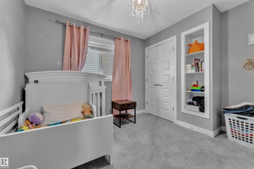Room featuring soft gray carpeting and gray wall paint - 1942 Chapman Road Sw, Edmonton, AB - Indoor Photo Showing Bedroom