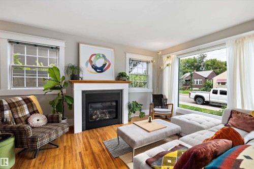 9851 86 Avenue Nw, Edmonton, AB - Indoor Photo Showing Living Room With Fireplace