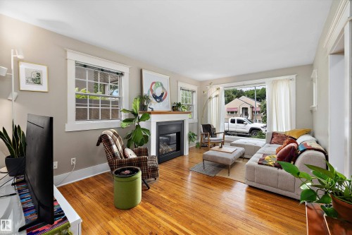 9851 86 Avenue Nw, Edmonton, AB - Indoor Photo Showing Living Room With Fireplace