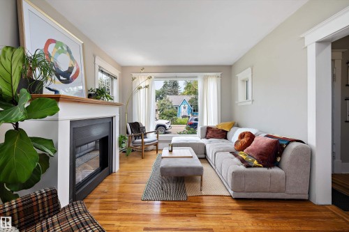 9851 86 Avenue Nw, Edmonton, AB - Indoor Photo Showing Living Room With Fireplace