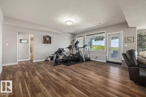 87 Lakeland Crescent, Beaumont, AB - Indoor Photo Showing Gym Room