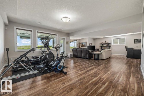 87 Lakeland Crescent, Beaumont, AB - Indoor Photo Showing Gym Room