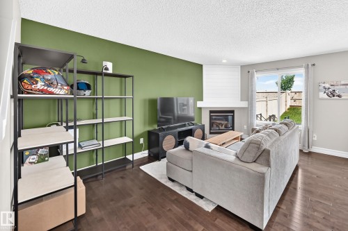 15908 10 Avenue Sw, Edmonton, AB - Indoor Photo Showing Living Room With Fireplace