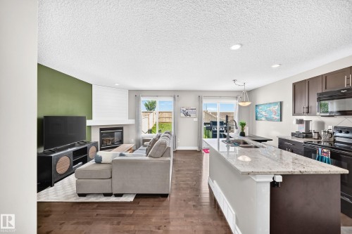 15908 10 Avenue Sw, Edmonton, AB - Indoor Photo Showing Other Room With Fireplace