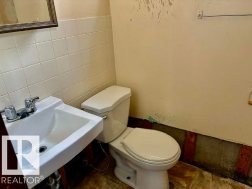 White rectangular wall-mounted sink with chrome faucet hardware - 5206 51Ave, Willingdon, AB - Indoor Photo Showing Bathroom