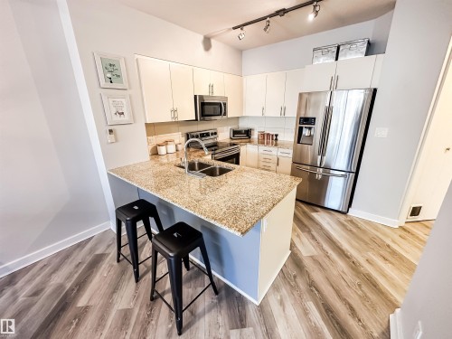 #703 10152 104 St Nw, Edmonton, AB - Indoor Photo Showing Kitchen With Double Sink With Upgraded Kitchen
