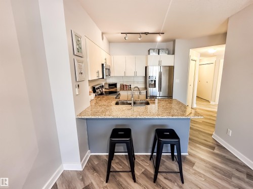 #703 10152 104 St Nw, Edmonton, AB - Indoor Photo Showing Kitchen With Double Sink With Upgraded Kitchen