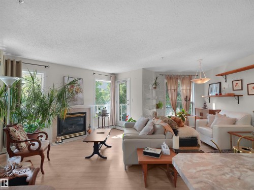 #203 9760 174 St Nw, Edmonton, AB - Indoor Photo Showing Living Room With Fireplace