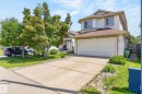Two-story residence featuring light-colored siding and a brown shingle roof - 3211 Mcphadden Place Sw, Edmonton, AB  - Outdoor 