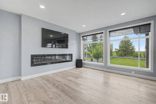 1463 Howes Crescent Sw, Edmonton, AB - Indoor Photo Showing Living Room With Fireplace